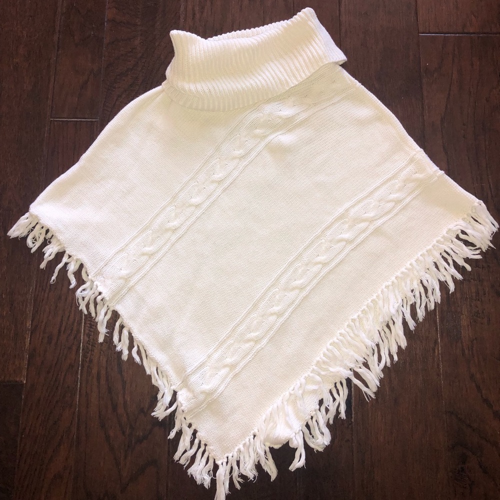 Girls white poncho with fringe detail